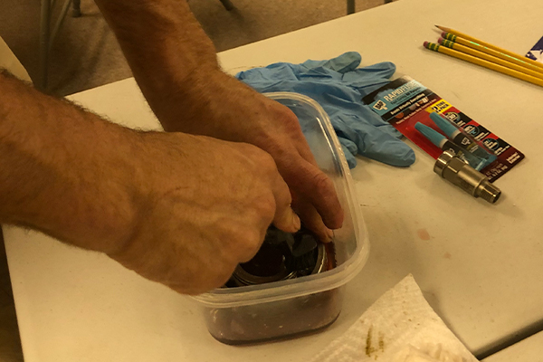 Student Cleaning a Bearing