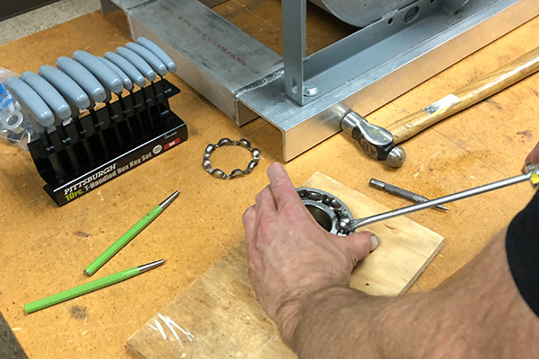 Student removing shields of a bearing