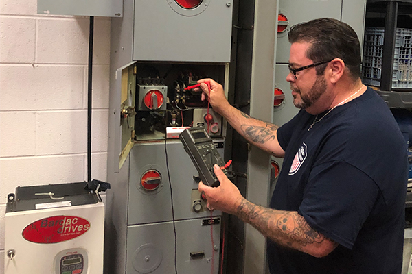 Student working on an electrical box