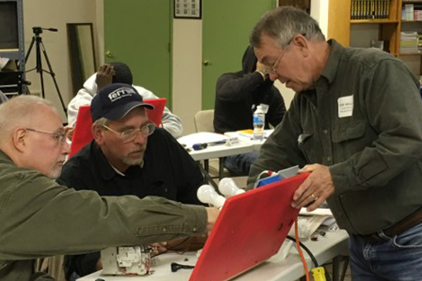 Trainer working with students