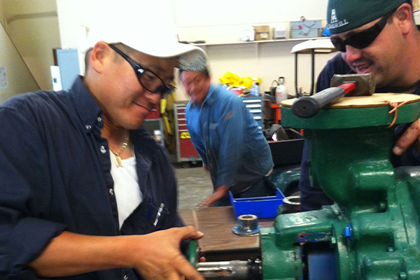 Students rebuilding a pump