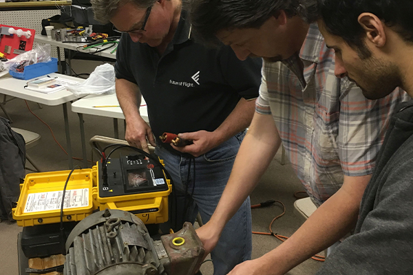 Students working on a motor