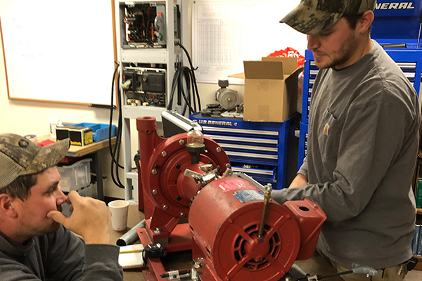Students working on a motor