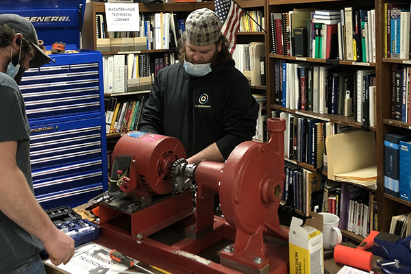 Student performing a hands on exercise in class