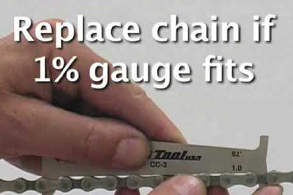 Student using a Wear Gauge for a Chain