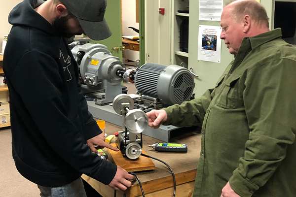 Students testing equipment for vibrations